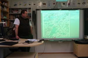 Tero Mustonen reviews the plans in the workshop.