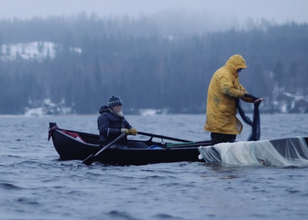 Markku Aho, rowing on the left, seining on a lake in Kontiolahti in 2014. Snowchange